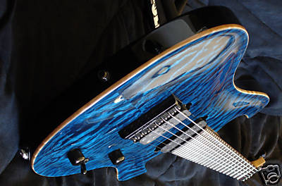 -Bolt on one piece QuarterSawn Curly Maple Neck<br />-Graphite Reinforcing Rods - Two way adjustable Truss rod<br />- EXTENDED 26.5&quot; Neck Scale with 24 Jumbo Frets<br />-Graphite nut