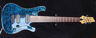 -Body is Honduran Mahogany with a 5A (10) Quilted maple top, its a thick top, almost 1&quot; thick Finished in a blue triple stain. Has natural masked binding. Gloss Black on the back.<br />-2 Humbuckers, Tom Anderson, both tapped, 1 Volume, I tone/coil tap and 3 way toggle.<br />-Schecter Engraved Brass Bridge with Graphtech String Savers<br />-Schaller Strap Locks and Planet Waves Padded Strap<br /><br />Цена то всего 2100  :lol: